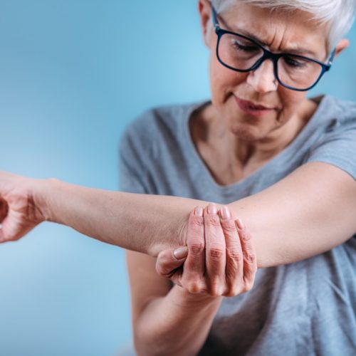 Senior woman with painful elbow.